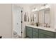 Bright bathroom featuring a double vanity with marble countertop and decorative decor at 5950 Kelseys Mill Rd, Ravenel, SC 29470