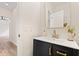 Modern half bathroom with a stylish black vanity and gold hardware at 5950 Kelseys Mill Rd, Ravenel, SC 29470