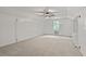 An empty bedroom with a ceiling fan, a window, neutral walls, and carpeted floors at 5950 Kelseys Mill Rd, Ravenel, SC 29470