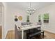 Elegant dining room featuring modern chandelier lighting and stylish furnishings, perfect for entertaining guests at 5950 Kelseys Mill Rd, Ravenel, SC 29470