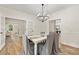 Elegant dining room featuring modern chandelier lighting and stylish furnishings, perfect for entertaining guests at 5950 Kelseys Mill Rd, Ravenel, SC 29470