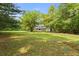 Stunning home with a large front yard and inviting porch at 5950 Kelseys Mill Rd, Ravenel, SC 29470