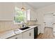 Charming kitchen sink with modern hardware, white cabinets, and natural light at 5950 Kelseys Mill Rd, Ravenel, SC 29470
