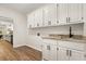 Convenient laundry room with a sink, countertop space, and ample storage at 5950 Kelseys Mill Rd, Ravenel, SC 29470