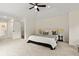 Airy main bedroom boasts natural light, tray ceilings, and calming neutral tones at 5950 Kelseys Mill Rd, Ravenel, SC 29470