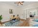 Bright home office featuring natural light, hardwood floors, and a stylish workspace in a modern design at 5950 Kelseys Mill Rd, Ravenel, SC 29470