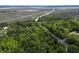 Aerial view of the location with lush tree coverage and a nearby waterway offering scenic views at 60 Fenwick Hall Aly # 937, Johns Island, SC 29455