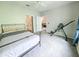 Bright bedroom features carpet floors, a ceiling fan, and views into the main bathroom at 60 Fenwick Hall Aly # 937, Johns Island, SC 29455