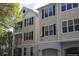 Inviting townhouse with classic curb appeal, featuring a charming balcony and well-maintained landscaping at 60 Fenwick Hall Aly # 937, Johns Island, SC 29455