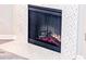 Close up of cozy fireplace with striking mosaic tile surround and contemporary design at 60 Fenwick Hall Aly # 937, Johns Island, SC 29455