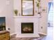 Close up of a fireplace and mantle with detailed geometric tile design and views of the living room at 60 Fenwick Hall Aly # 937, Johns Island, SC 29455