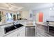 Open kitchen with stainless steel appliances, breakfast bar, and a seamless flow to the living areas at 60 Fenwick Hall Aly # 937, Johns Island, SC 29455