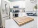 Well-equipped kitchen with stainless appliances, white cabinetry, and a subway tile backsplash at 60 Fenwick Hall Aly # 937, Johns Island, SC 29455