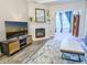 Stylish living room features a fireplace, modern furnishings, and an inviting atmosphere for relaxation at 60 Fenwick Hall Aly # 937, Johns Island, SC 29455