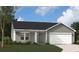 New construction single-Gathering home showcasing a two-car garage and modern design at 6209 Portsman Ln, Summerville, SC 29485