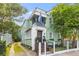Charming two-story home featuring a porch and well-maintained landscaping at 9 Kracke St # A & B, Charleston, SC 29403