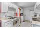 Functional kitchen with gas range, white cabinets, and ample countertop space at 9 Kracke St # A & B, Charleston, SC 29403