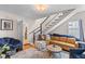 Cozy living room with hardwood floors, staircase and comfortable seating arrangement at 9 Kracke St # A & B, Charleston, SC 29403