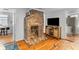 Spacious living room boasting hardwood floors, brick fireplace, and natural light at 9 Kracke St # A & B, Charleston, SC 29403