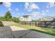 Spacious backyard with a patio, lush grass, and a privacy fence at 9609 Portal Ct, Summerville, SC 29485