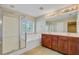 Bathroom featuring a double vanity, bathtub, and separate glass shower at 9609 Portal Ct, Summerville, SC 29485