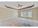 Spacious bedroom featuring a tray ceiling and natural light at 9609 Portal Ct, Summerville, SC 29485