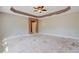 Spacious bedroom with a tray ceiling and ceiling fan at 9609 Portal Ct, Summerville, SC 29485