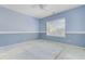 Cozy blue bedroom featuring fresh paint and a large window at 9609 Portal Ct, Summerville, SC 29485