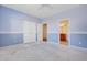 Spacious blue bedroom featuring fresh paint and an ensuite bathroom at 9609 Portal Ct, Summerville, SC 29485