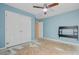 Spacious bedroom features a ceiling fan, closet, blue accent wall and natural light at 9609 Portal Ct, Summerville, SC 29485