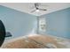 Bedroom features a ceiling fan, window and pale blue accent wall at 9609 Portal Ct, Summerville, SC 29485