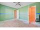 Green bedroom with a ceiling fan and an open closet at 9609 Portal Ct, Summerville, SC 29485