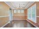 Dining room features wood floors, large windows, and a trey ceiling at 9609 Portal Ct, Summerville, SC 29485