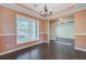 Formal dining room features crown molding, wainscoting, and an elegant chandelier at 9609 Portal Ct, Summerville, SC 29485