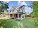 Beautiful two-story home with a manicured lawn, covered porch, and attached garage at 9609 Portal Ct, Summerville, SC 29485