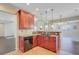 Cherry cabinets, granite countertops, and stainless appliances highlight this kitchens charm at 9609 Portal Ct, Summerville, SC 29485