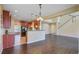 Open floor plan featuring a kitchen with pendant lighting, wood cabinets, and stainless steel appliances at 9609 Portal Ct, Summerville, SC 29485
