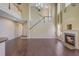 Spacious living room with hardwood floors, a cozy fireplace, and soaring ceilings at 9609 Portal Ct, Summerville, SC 29485