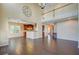 Expansive living area with hardwood floors, seamless transition to the kitchen, and ample natural light at 9609 Portal Ct, Summerville, SC 29485