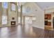 Open-concept living area featuring a fireplace, tall ceilings, and seamless transition to the kitchen at 9609 Portal Ct, Summerville, SC 29485