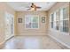 Sunroom with tile floors, large windows, and a ceiling fan at 9609 Portal Ct, Summerville, SC 29485
