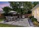 Well-maintained backyard featuring a stone patio, outdoor seating, dining area, grill, and privacy fence at 9670 Pebble Creek Blvd, Summerville, SC 29485