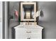 This bathroom offers a vanity with marble countertop, brushed gold hardware, and a modern mirror with a towel rack at 9670 Pebble Creek Blvd, Summerville, SC 29485