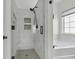 New bathroom offers an elegant walk-in shower with marble tile and a relaxing soaking tub with marble surround at 9670 Pebble Creek Blvd, Summerville, SC 29485
