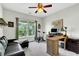 Home office with an exercise bike and couch at 9670 Pebble Creek Blvd, Summerville, SC 29485