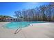 This community pool features lane lines, multiple entry points, and a pergola with lounge chairs at 9670 Pebble Creek Blvd, Summerville, SC 29485