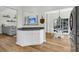 Kitchen area shows white cabinets and breakfast nook leading to the living room at 9670 Pebble Creek Blvd, Summerville, SC 29485