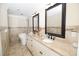 Elegant bathroom featuring double sinks, granite counters, tile floors and a soaking tub at 100 N Gateshead Xing, Goose Creek, SC 29445