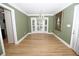 An airy dining room showcasing wood floors, stylish chandelier, and large bay window at 100 N Gateshead Xing, Goose Creek, SC 29445