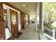 Charming front porch with wood flooring and a view of the yard at 100 N Gateshead Xing, Goose Creek, SC 29445